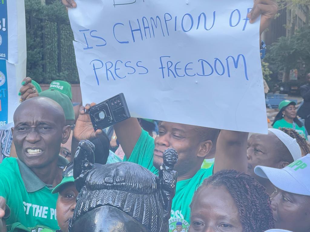 Sierra Leonean public official displaying a placard in New York