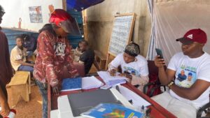 An Okada rider registering at a land raffle centre. Photo Credit: Ministry of Lands, Housing and Country Planning on Facebook.