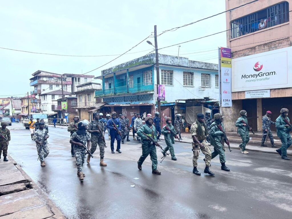 Sierra Leone Police and military are marching the street to quell protests.